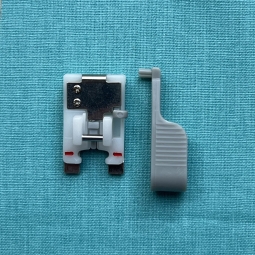 Pied pour pose précise de bouton Husqvarna Viking