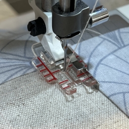 Pied ajustable 1/4" de patchwork avec guide Husqvarna Viking